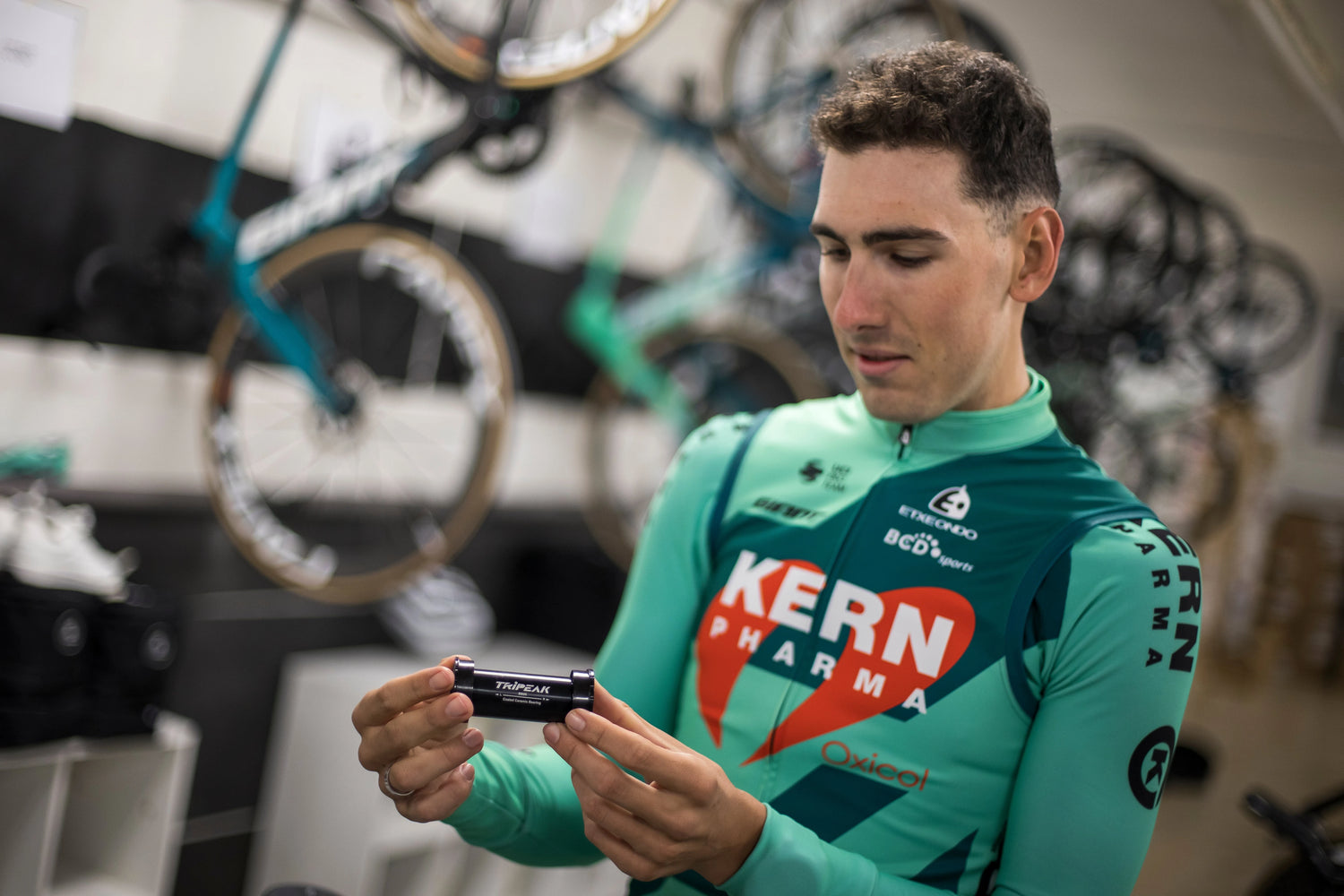 Pro Cyclist Miguel Angel Fernandez Ruiz from Kern Pharma team holding a Tripeak ceramic bottom bracket